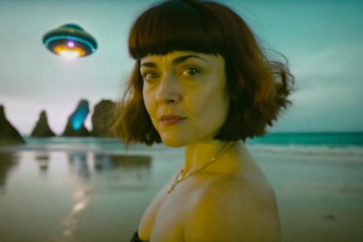 Artificial Intelligence (AI) generated image art, woman, cinematic, shot on kodak gold, standing on a beautiful beach watching as an alien spacecraft as it descends to the earth, she looks youtful maybe mid 30s